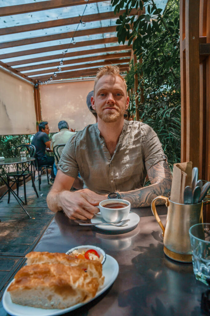 Blogger Robin drinking coffee at Nin Cafe Mexico City.