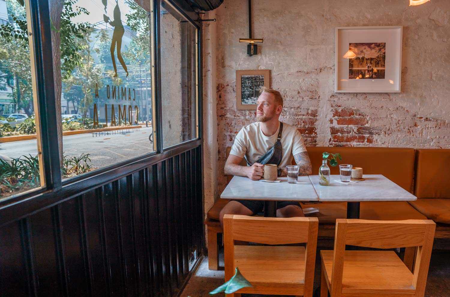 Blogger Robin drinking sociality coffee at Camino a Camala one of the best coffee shops in Mexico City.