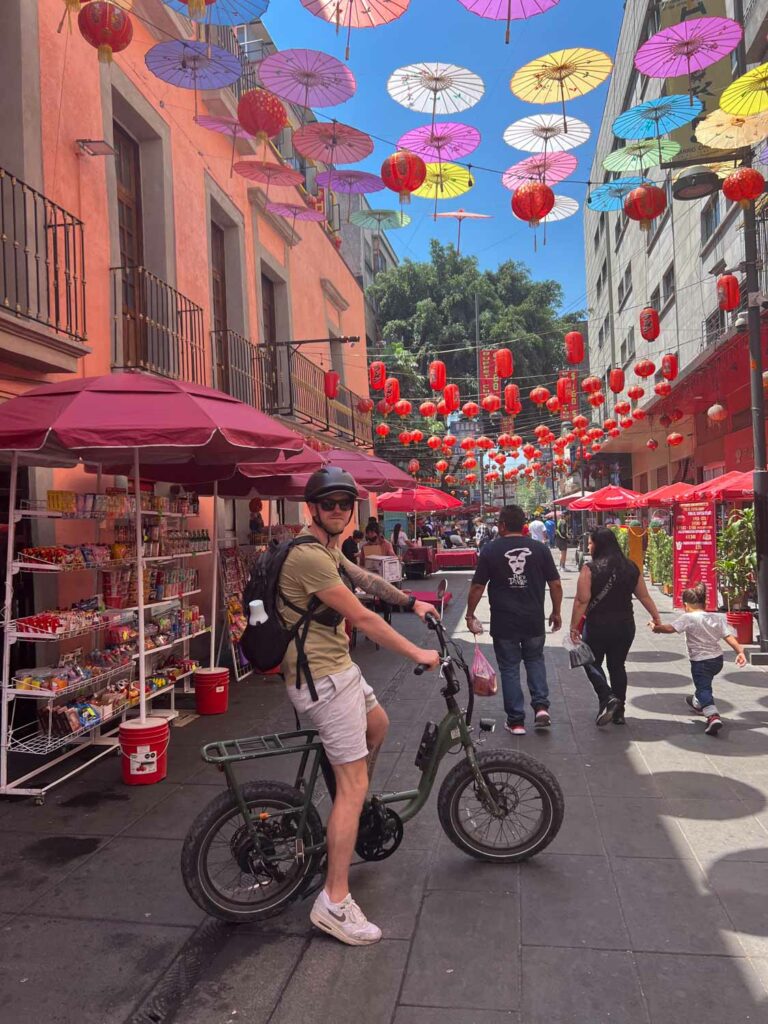 Blogger Robin cycling through China Town Mexico City