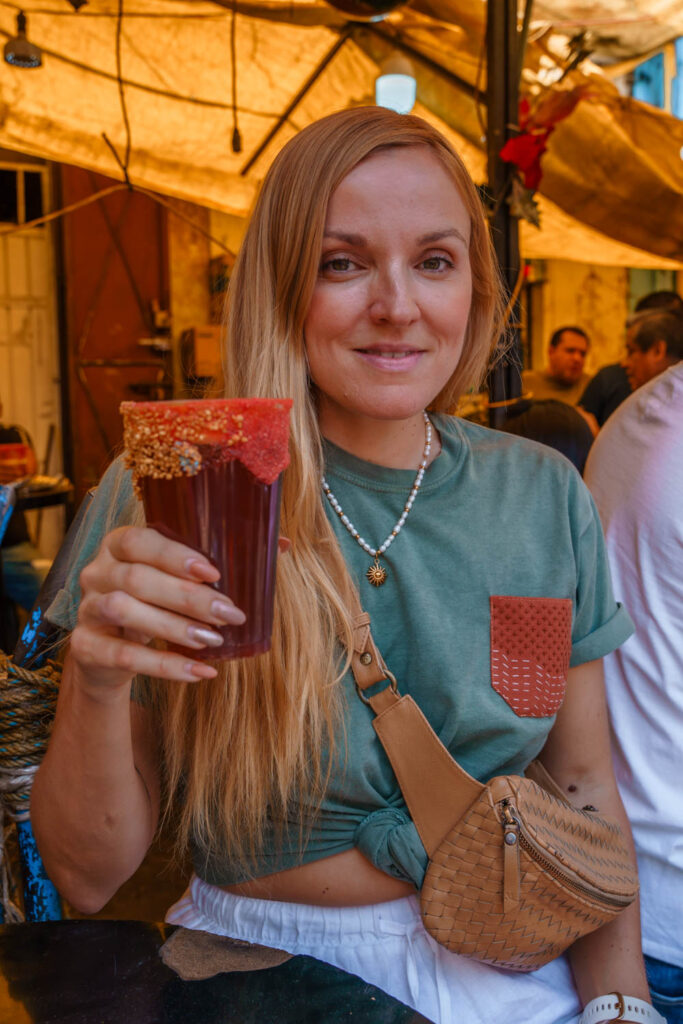 Blogger Mal drinking michelada at La Merced one of the biggest markets of Mexico City.
