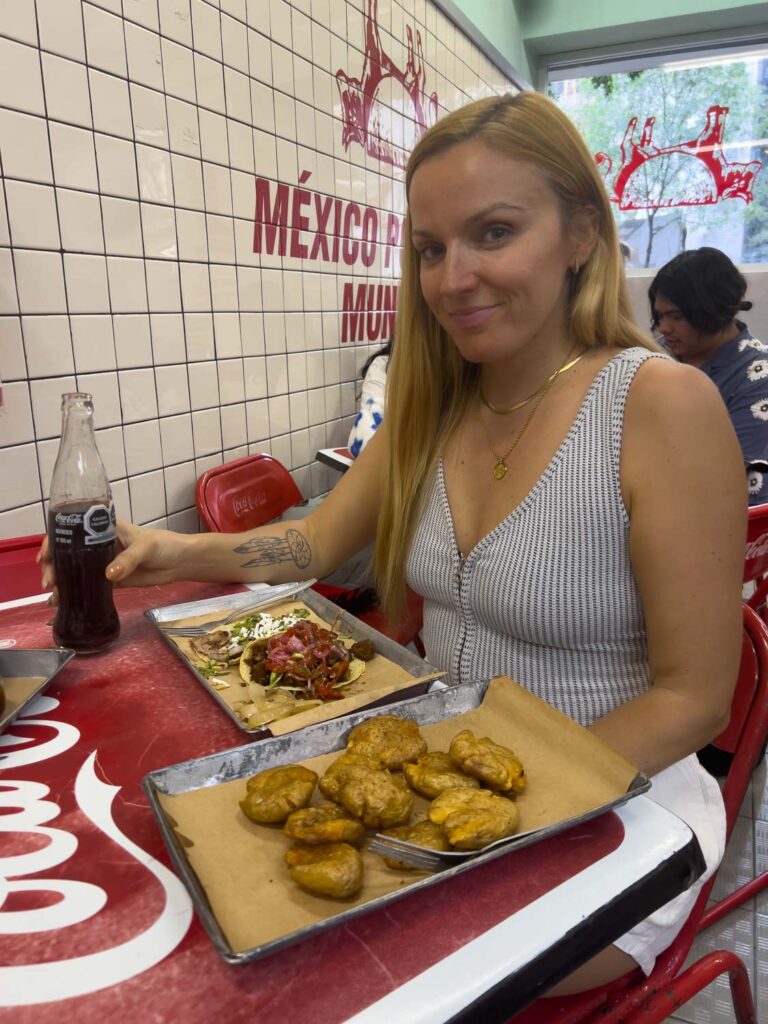 Mal enjoying her tacos at Orinoco Taqueria in Roma Norte